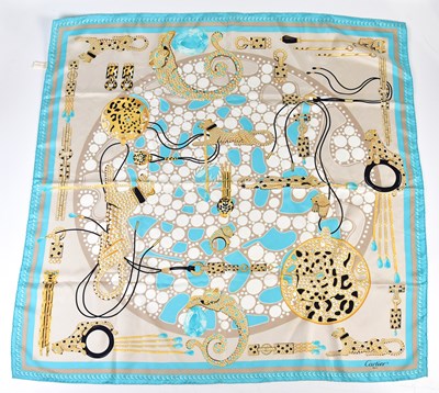 Lot 937 - CARTIER; a 100% silk beige, gold and turquoise...