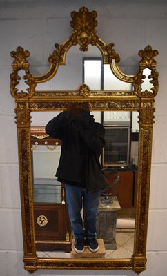 Lot 23 - A reproduction decorative gilt framed wall...