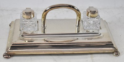 Lot 694 - A silver plated ink standish with twin cut...