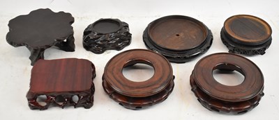 Lot 653 - A group of seven Chinese hardwood stands.