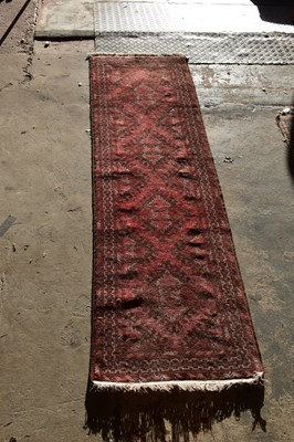 Lot 6479 - A red ground Heriz style runner, 265cm x 77cm.