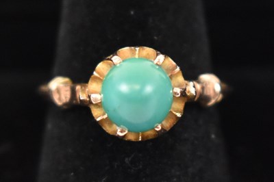 Lot 785 - A 14ct yellow gold turquoise set ring, size O,...
