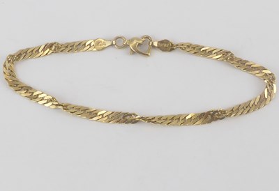 Lot 912 - A 14ct gold (585) flat curb link with a twist bracelet