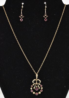 Lot 783 - An Edwardian 9ct yellow gold ruby and pearl...