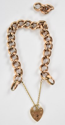 Lot 784 - A 9ct yellow gold curb link bracelet with...