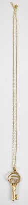 Lot 787 - A 9ct yellow gold pendant modelled as a key,...