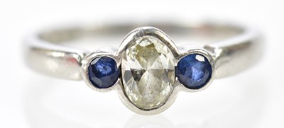 Lot 96 - A platinum sapphire and diamond three stone...