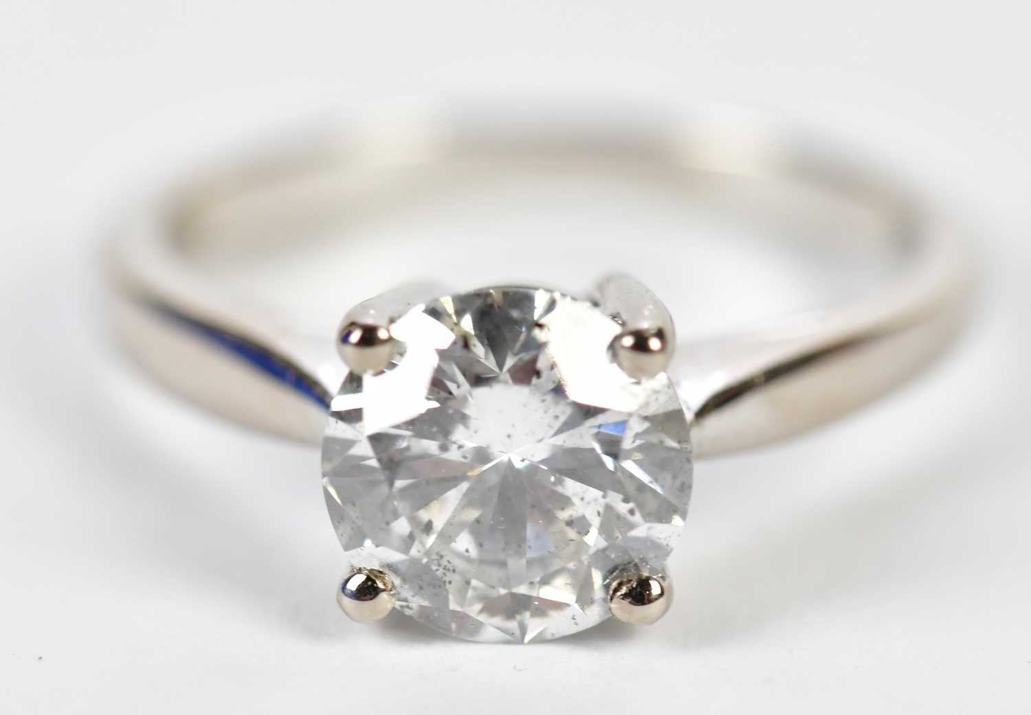 Lot 34 - An 18ct white gold single stone diamond...