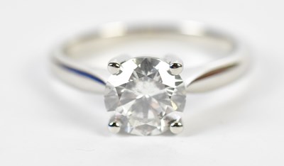 Lot 47 - A platinum and diamond single stone ring, the...