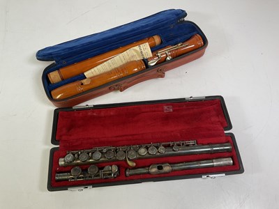 Lot 47 - Two musical instruments including a flute and...