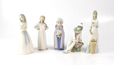 Lot 583 - LLADRÓ; a figure of a young girl in nightdress...