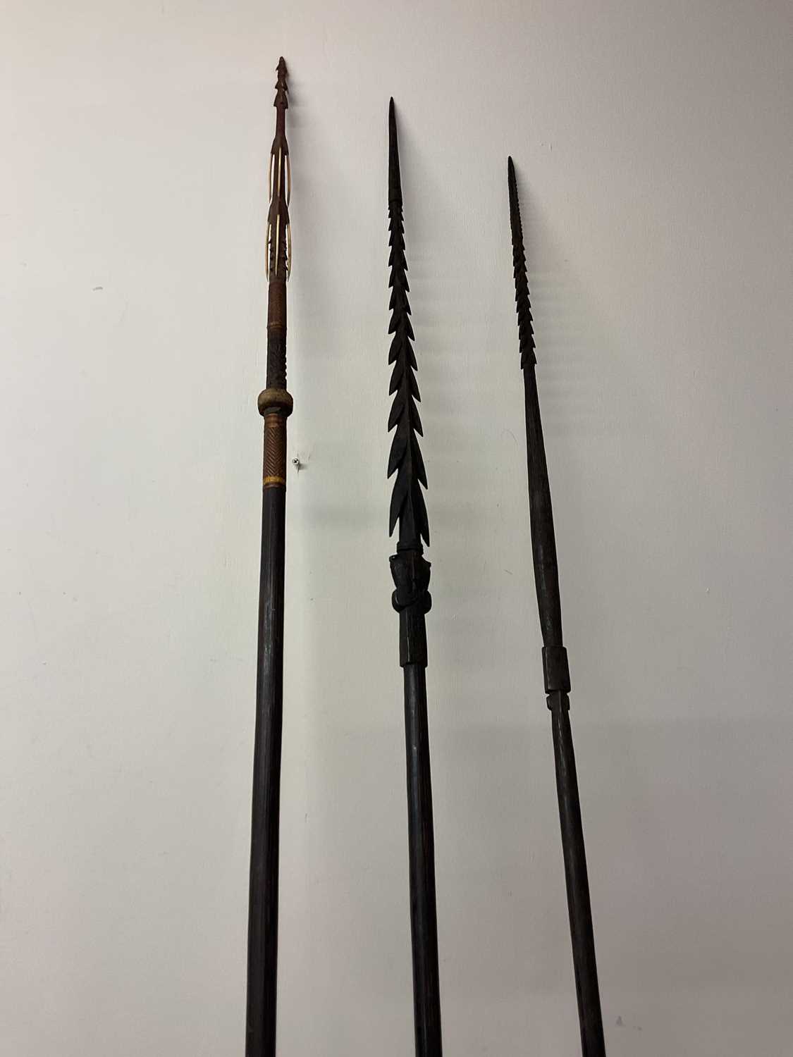 Lot 27 - Three carved Solomon Islands Spears, bought by...