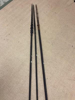 Lot 27 - Three carved Solomon Islands Spears, bought by...