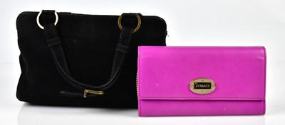 Lot 870 - GIANNI VERSACE; a black suede handbag...