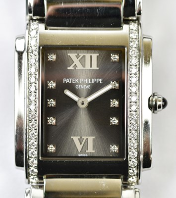 Lot 2843 - PATEK PHILIPPE; a stainless steel and diamond...