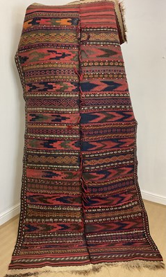 Lot 458 - A vintage handwoven Kilim formed from two...