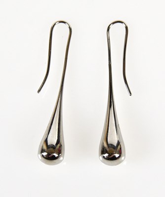 Lot 850 - CALVIN KLEIN; a pair of drop earrings, length...