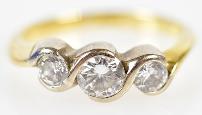 Lot 81 - An 18ct yellow gold three stone graduated...