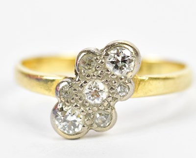 Lot 140 - A yellow metal platinum tipped seven stone...