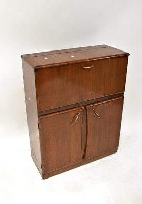 Lot 21 - A mid-20th century walnut veneered cocktail...