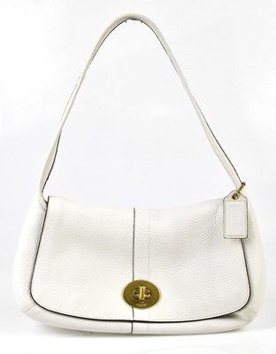 Lot 905 - COACH; a unused white thick pebbled leather...