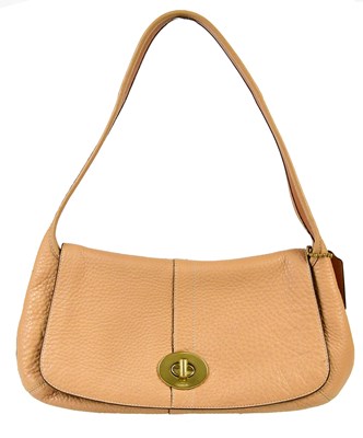 Lot 906 - COACH; an unused tan thick pebbled leather...