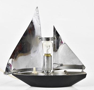 Lot 5522 - A small chrome lamp modelled as a yacht,...