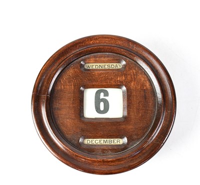 Lot 122 - An early 20th century oak circular...