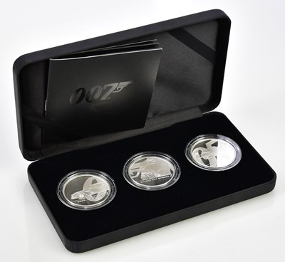 Lot 3182 - THE ROYAL MINT; a cased set of three 007 James...