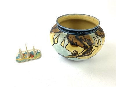 Lot 5529 - CLARICE CLIFF; a three bar toast rack, with a...