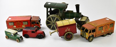 Lot 4414 - A group of five tin plate toys to include two...