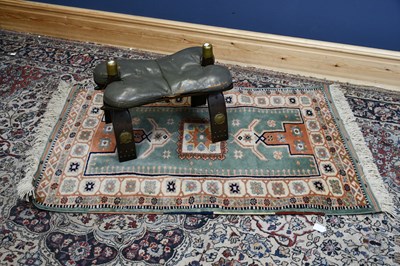 Lot 6484 - A Turkish wool rug with stylised decoration,...
