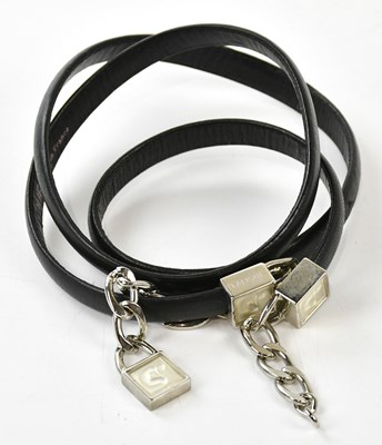 Lot 852 - LALIQUE; a slim black leather belt with silver...