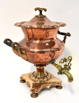 Lot 412 - A Victorian copper and brass tea urn.
