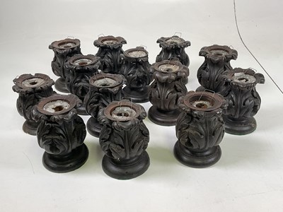 Lot 58 - A quantity of carved oak candlesticks, made...