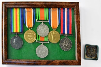 Lot 595 - A group of WWI and WWII medals comprising...