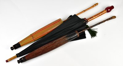 Lot 951 - A vintage 1920s black silk umbrella with...