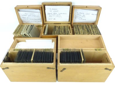 Lot 551 - Two wooden cases containing positive stereo glass slides