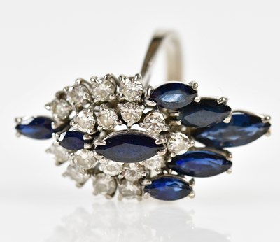 Lot 38 - An 18ct white gold sapphire and diamond...