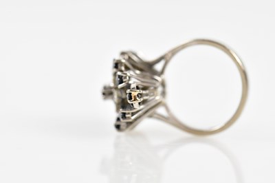 Lot 38 - An 18ct white gold sapphire and diamond...