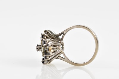Lot 38 - An 18ct white gold sapphire and diamond...