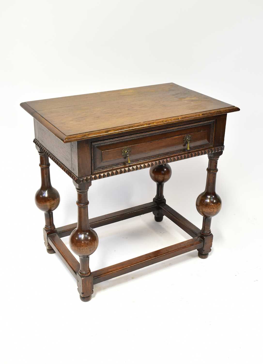 Lot 24 - A reproduction side table of Jacobean style,...