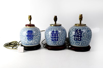 Lot 363 - Three 20th century Chinese blue and white ovoid lamps