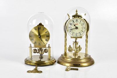 Lot 6417 - Two anniversary clocks, both under glass domes...