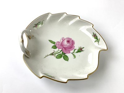 Lot 1282 - MEISSEN; a rose painted leaf shaped dish with...