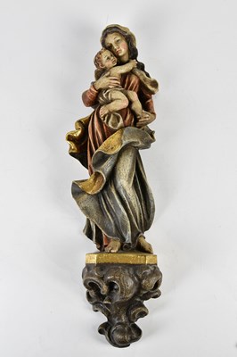 Lot 5081 - A mid-20th century carved wooden figure of...