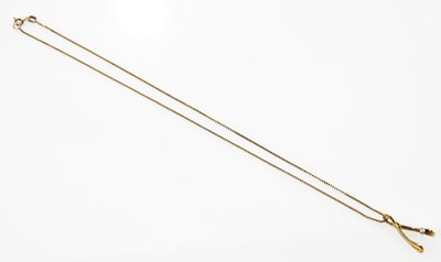 Lot 420 - A 9ct yellow gold box link chain suspending a...