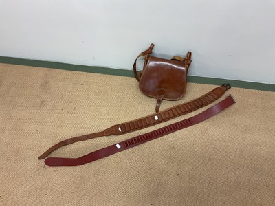 Lot 21 - A shot gun leather case and two cartridge...