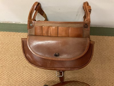 Lot 21 - A shot gun leather case and two cartridge...