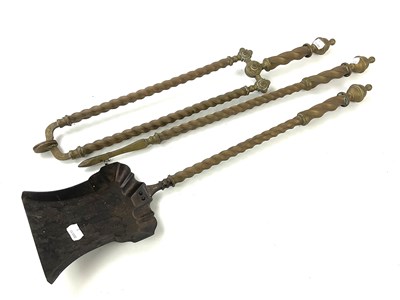 Lot 6366 - A Victorian brass three piece companion set...